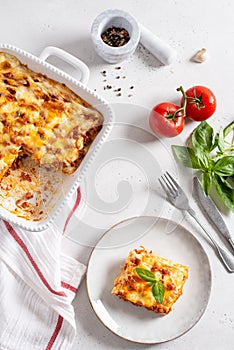 Traditional italian lasagna with vegetables, minced meat, cheese bolognese and bechamel sauce. Top view, menu, recipe