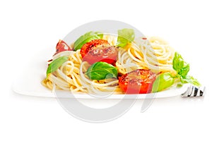Traditional italian macaroni pasta with grilled tomato and orega