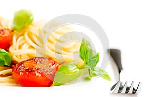 Traditional italian macaroni pasta with grilled tomato and orega