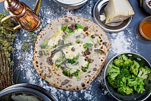 Traditional italian pizza with mozzarella, broccoli and salsiccia