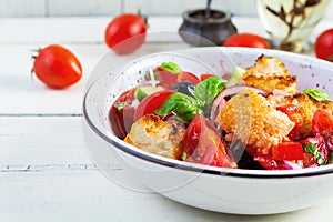 Traditional italian salad Tuscan Panzanella with tomato, bread and pickled olives