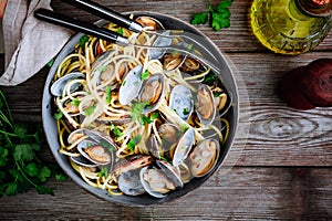 Traditional italian seafood pasta with clams Spaghetti alle Vongole in the pan