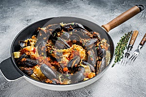 Traditional italian seafood pasta with mussels, Spaghetti and tomato sauce. White background. Top view