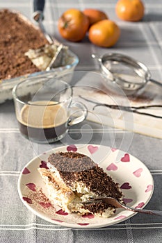 Traditional Italian tiramisu cake flavoured with coffee and topped with chocolate and cocoa