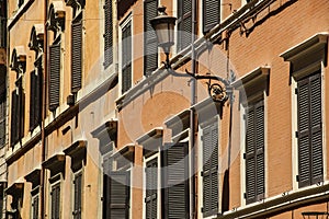 Traditional Italian windows with shutters in one of the houses o