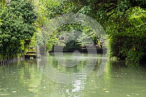 Traditional Japanese boat cruising in Yanagawa canal, Japan