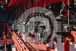 Traditional Japanese bronze lanterns in a shinto temple in Nara Japan