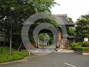 Traditional Japanese Buddhist temple gate and garden