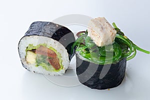 traditional Japanese cuisine. japanese sushi isolated on white background. vegetarian maki sushi with avocado tomato soft cheese