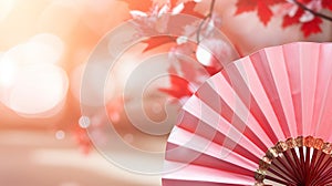 Traditional Japanese fan with red autumn leaves, fall vibes background