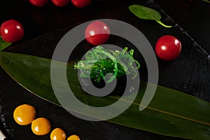 Traditional Japanese food - sushi, rolls and sauce on a black background. Top view.