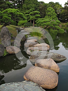 Traditional Japanese Garden with stepping stone pathways photo