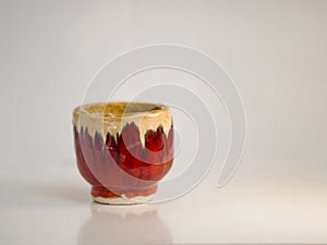 A traditional japanese goblet seperated on a white background.