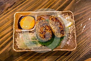 Traditional Japanese grilled chicken, Yakitori, with marinated egg yolk