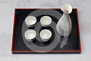 Traditional Japanese sake set on a tray