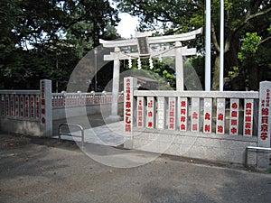 Traditional Japanese stone gate and fence at the Buddhist temple