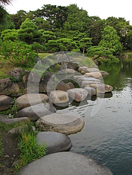 Traditional Japanese stroll garden with stepping stones