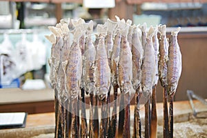 Traditional japanese style grilled fish Ayu stick with salt in local restaurant at Takayama, Japan.