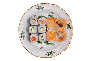 Traditional japanese sushi menu. Close-up of various kinds of sushi rolls with salmon, sashimi and other slices of raw fish served