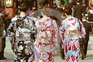 Traditional japanese women wearing Kimono walking towards temple at the Senso-ji temple, Asakusa, Tokyo, Japan