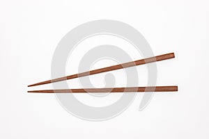 Traditional Japanese wooden chopsticks on white background