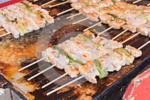 Traditional japanese yakitori chicken on pan