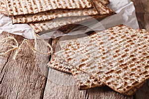 Traditional Jewish kosher matzo for Passover macro on a table. h