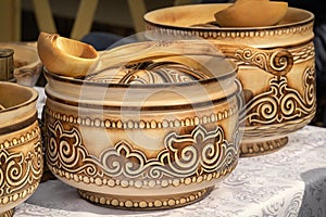 Traditional Kazakh wooden tableware with national ornament is sold on the market