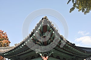 Traditional Korean Hanok Village building with old wooden green roof in the afternoon in Seoul, South Korea