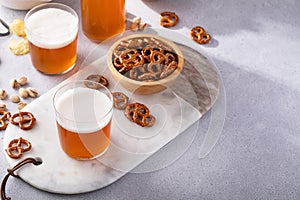 Traditional lager beer in variety of glasses with snacks on the table