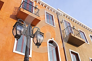 Traditional lamp post on the wall of a building