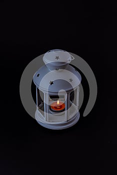 Traditional lantern with burning scented candle