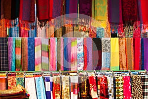 Traditional Laotian dresses and scarf in clothing store