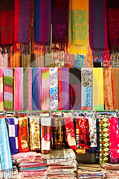 Traditional Laotian dresses and scarf in clothing store