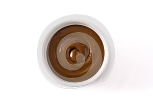 Traditional Latin American dulce de leche or manjar isolated on white background.