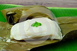 Traditional Lepat Pisang or pais pisang also known as Steamed Banana Packets photo