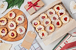 Traditional Linzer or sandwich Christmas cookies filled with raspberry jam photo