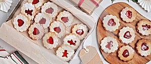 Traditional Linzer or sandwich Christmas cookies filled with raspberry jam photo