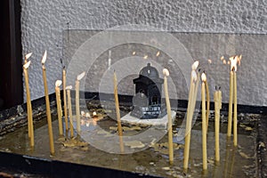 Traditional lit candles outside a Greek Orthodox Church