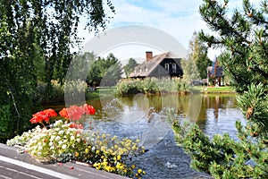 Traditional Lithuanian manor with garden pond