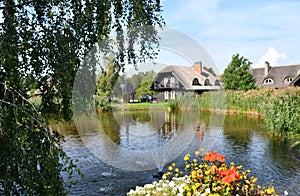 Traditional Lithuanian manor with garden pond