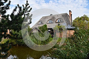 Traditional Lithuanian manor with garden pond