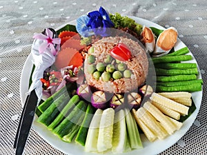 Traditional local thai southern food Stir fried chilli dip fried rice with chili paste served with sweet pork and salted egg and