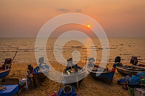 Traditional long tail boat on Pattaya beach at sunset, Thailand