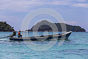 Traditional longtail boat of Moken (sea gypsy) at Surin island photo