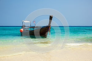 Traditional longtail boat on the tropical beach near Koh Phi Phi Island, Thailand