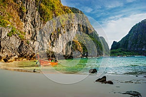 Traditional longtail boats in the famous Maya bay of Phi-phi Leh island, Thailand