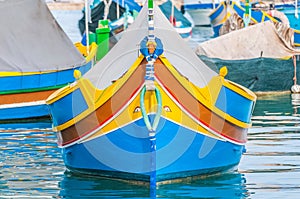 Traditional Luzzu boat at Marsaxlokk harbor in Malta