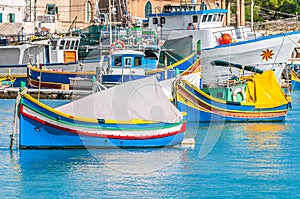 Traditional Luzzu boat at Marsaxlokk harbor in Malta