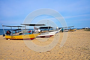 Traditional Malaysian fisherman boat on sandy beach